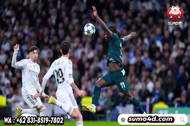 Pemain Manchester City, Jeremy Doku (kanan), beraksi dalam laga melawan Real Madrid pada laga Liga Champions di Madrid, Spanyol, Kamis, (11/12/2025).